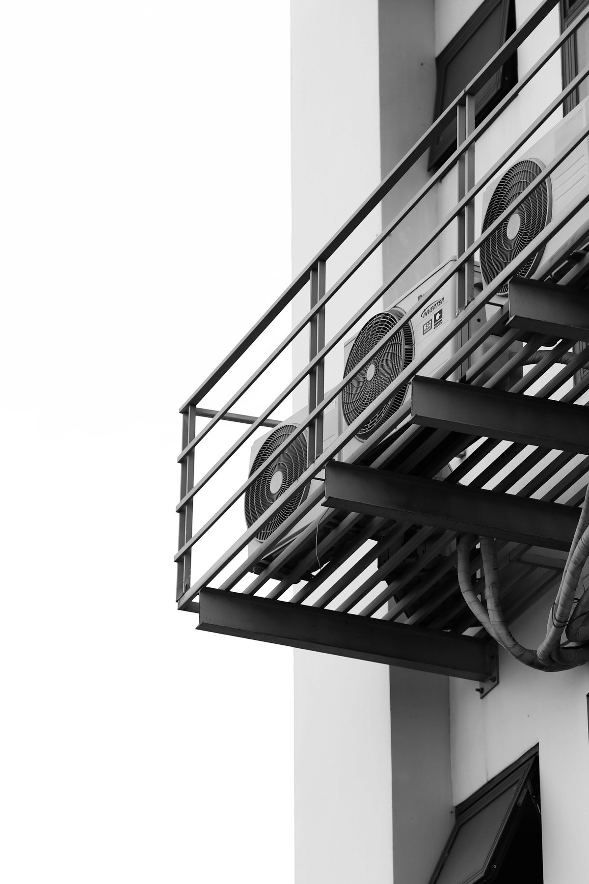 New air conditioner condenser units installed on a mounted platform